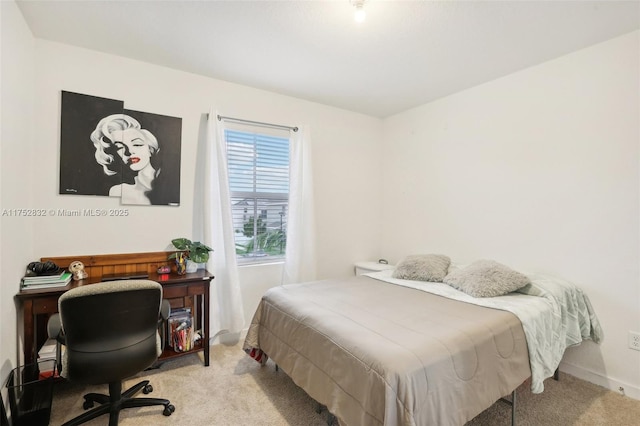 bedroom with light colored carpet