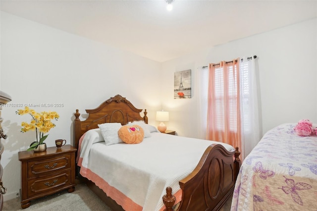 bedroom featuring light colored carpet