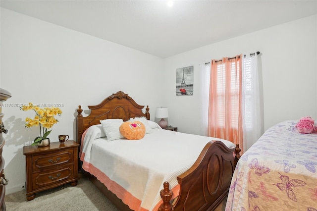 bedroom featuring light carpet