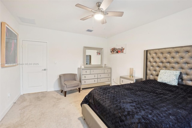 bedroom with baseboards, visible vents, a ceiling fan, and light colored carpet