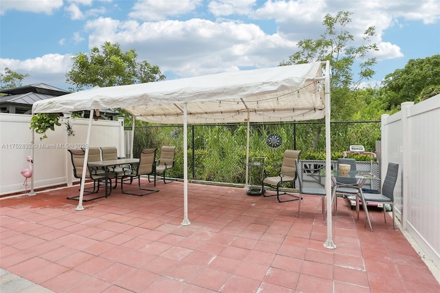 view of patio / terrace featuring fence and outdoor dining space