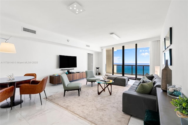 16275 Collins Ave Unit 1501, Sunny Isles Beach, FL 33160 - living room featuring visible vents, marble finish floor, and expansive windows