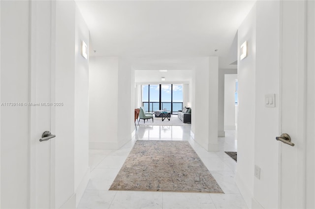 16275 Collins Ave Unit 1501, Sunny Isles Beach, FL 33160 - corridor with baseboards and marble finish floor