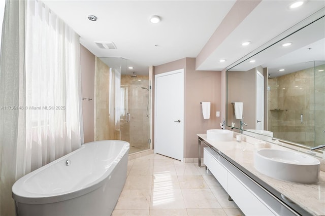 16275 Collins Ave Unit 1501, Sunny Isles Beach, FL 33160 - bathroom with double vanity, a shower stall, a freestanding bath, and a sink