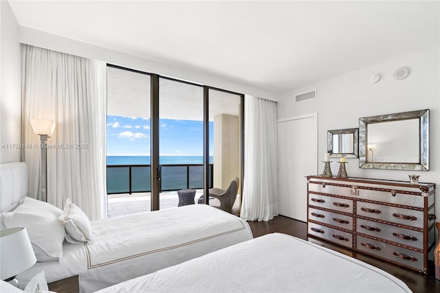 16275 Collins Ave Unit 1501, Sunny Isles Beach, FL 33160 - bedroom with visible vents, wood finished floors, access to exterior, and a water view