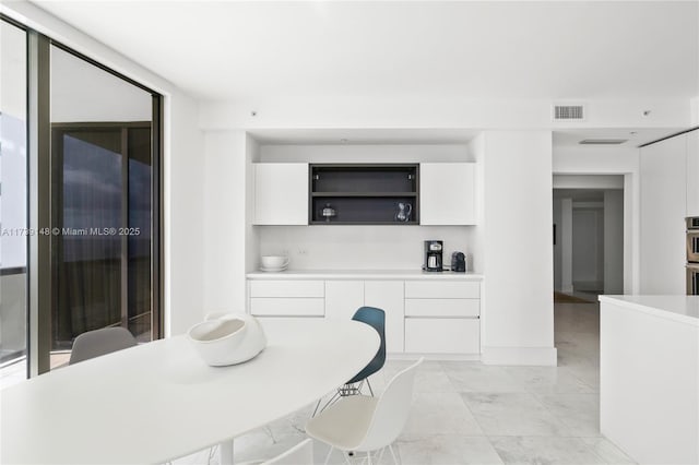 16275 Collins Ave Unit 1501, Sunny Isles Beach, FL 33160 - dining area featuring visible vents and expansive windows