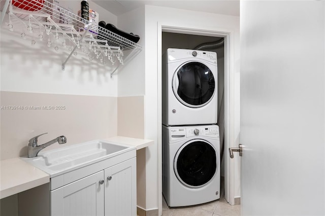 16275 Collins Ave Unit 1501, Sunny Isles Beach, FL 33160 - washroom with laundry area, light tile patterned floors, stacked washer / drying machine, and a sink
