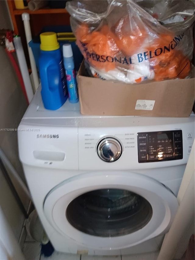 laundry room featuring washer / clothes dryer and laundry area