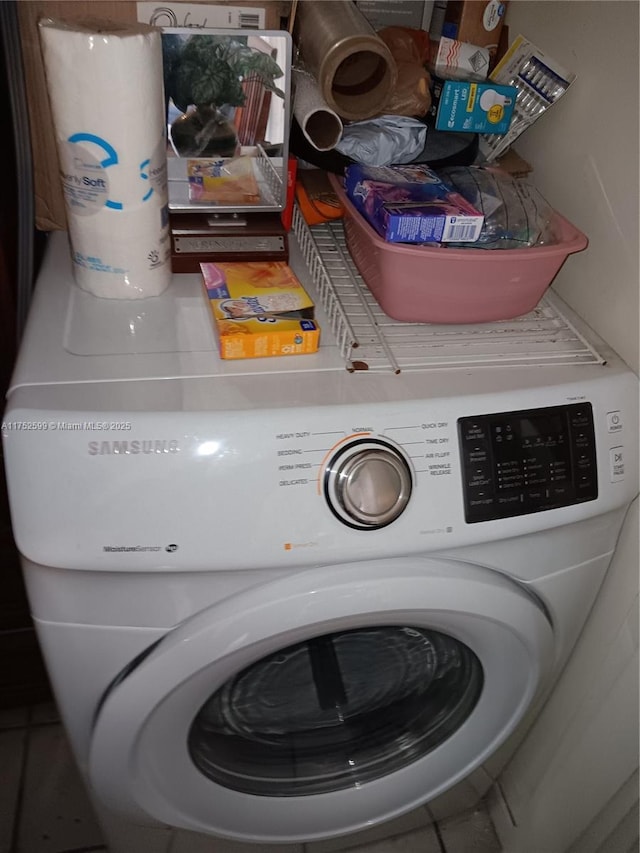 laundry room with laundry area and washer / dryer