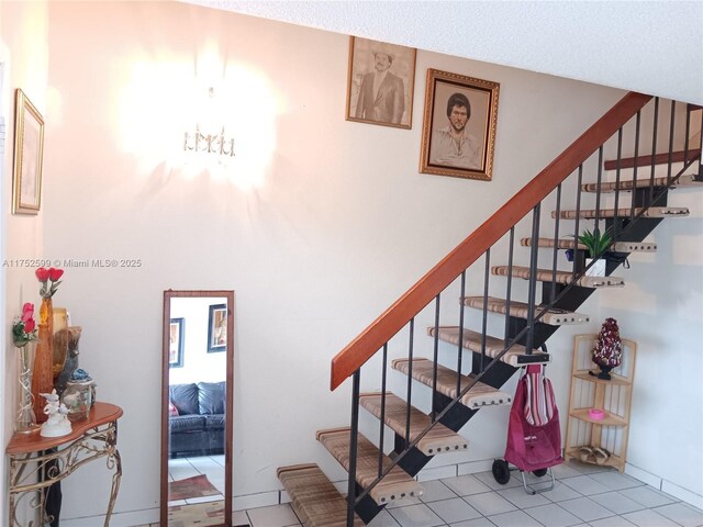 stairs featuring tile patterned floors