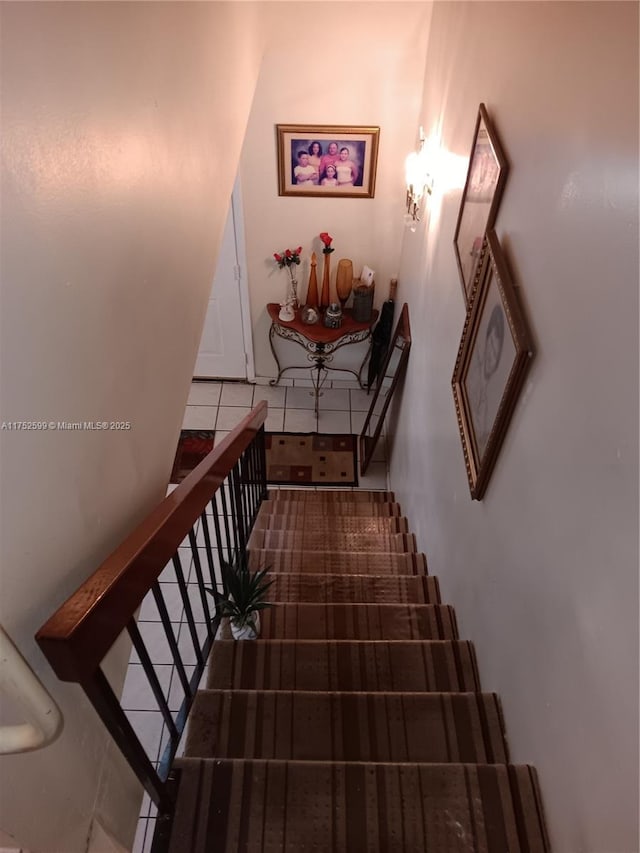 staircase with tile patterned flooring