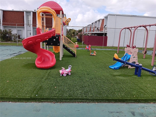 communal playground with a lawn