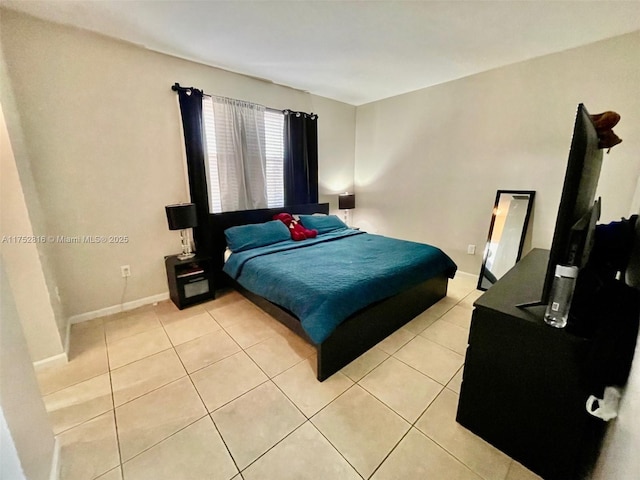 bedroom with a closet and tile patterned floors