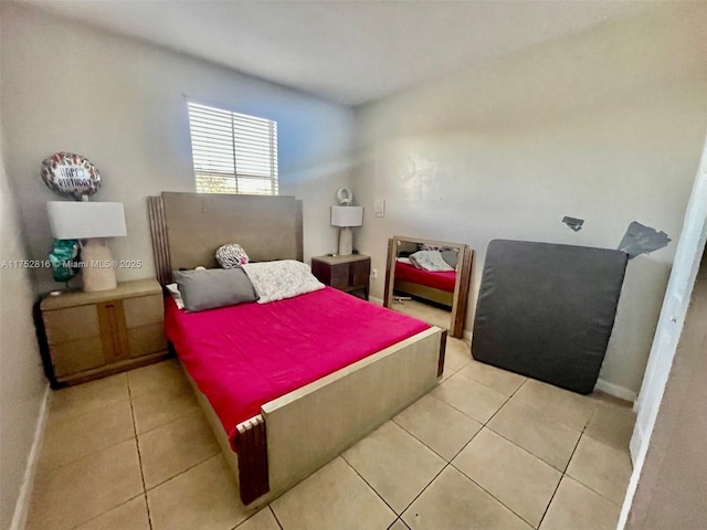 tiled bedroom with baseboards