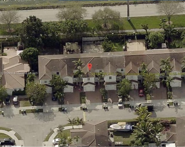 aerial view with a water view and a residential view