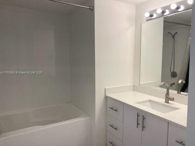 full bathroom with washtub / shower combination and vanity