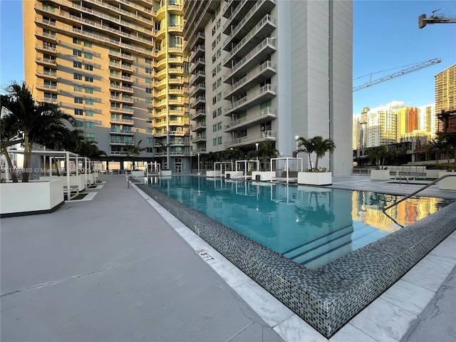 pool featuring a patio and a city view