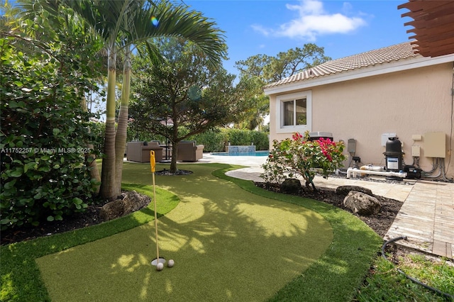 view of yard featuring an outdoor pool