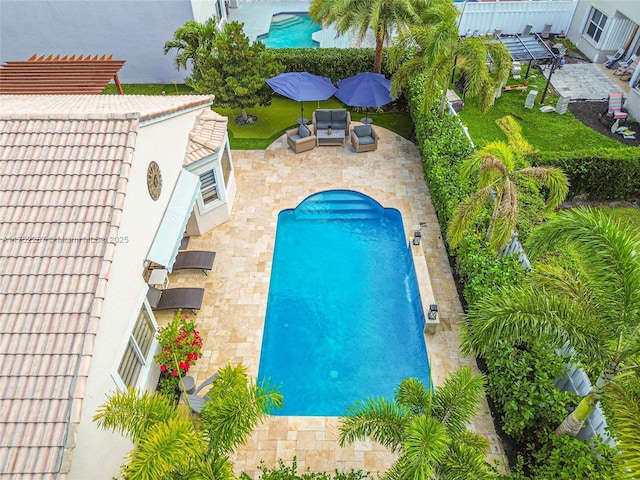 view of pool with an outdoor hangout area and a patio area