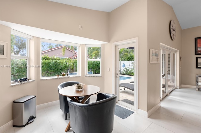 interior space featuring baseboards and light tile patterned floors