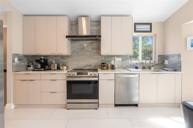 kitchen with wall chimney exhaust hood, appliances with stainless steel finishes, light countertops, and decorative backsplash