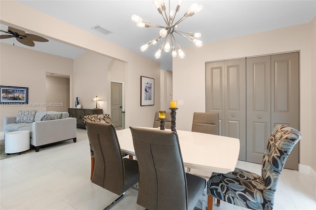 dining space with visible vents and ceiling fan with notable chandelier