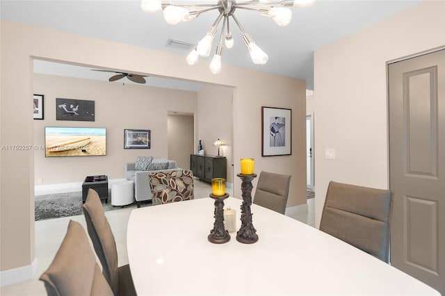 dining area featuring visible vents, baseboards, and ceiling fan with notable chandelier