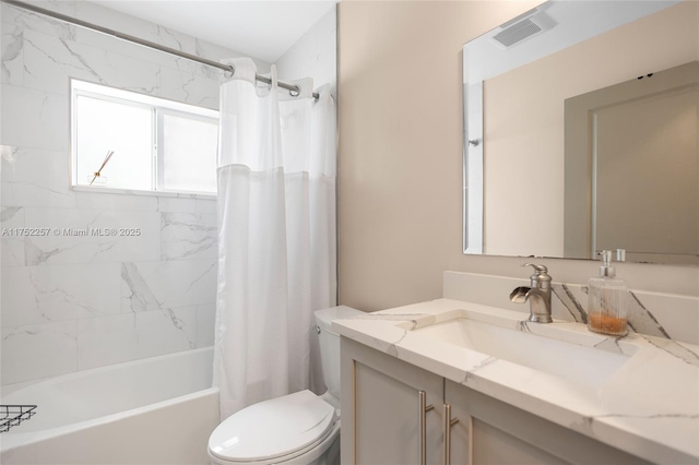 bathroom featuring toilet, shower / tub combo, visible vents, and vanity