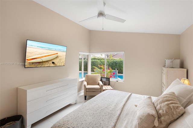 bedroom with lofted ceiling, light tile patterned flooring, and a ceiling fan