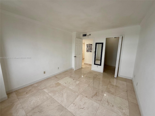 unfurnished bedroom featuring marble finish floor, visible vents, crown molding, and baseboards