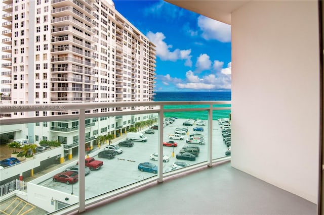 balcony featuring a view of city and a water view