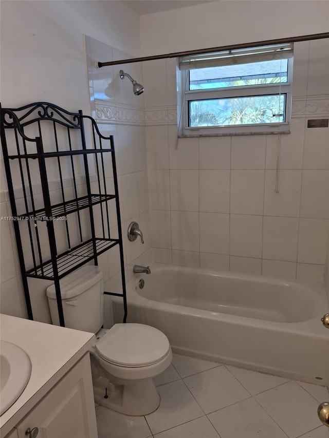 full bathroom featuring shower / bathtub combination, vanity, toilet, and tile patterned floors