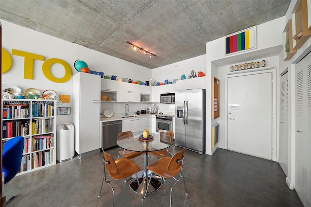 dining area featuring finished concrete flooring