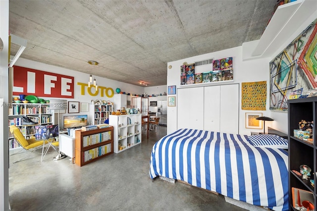 bedroom with concrete flooring and a closet