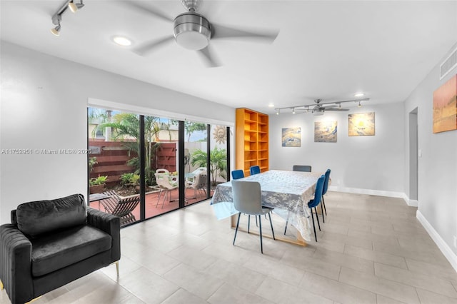 dining area with rail lighting, ceiling fan, and baseboards