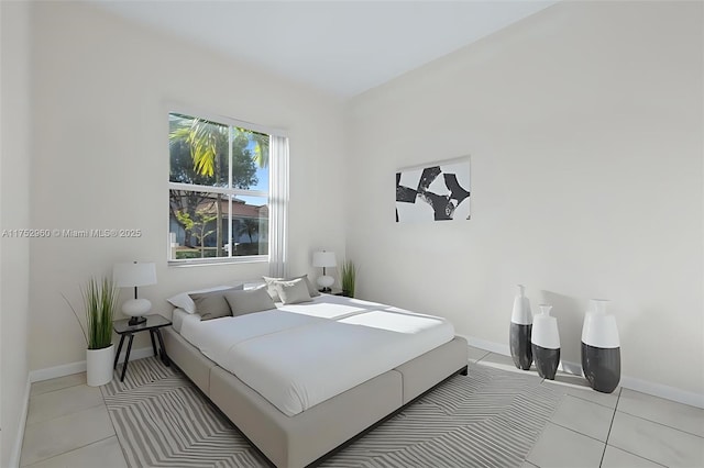 bedroom featuring light tile patterned floors and baseboards