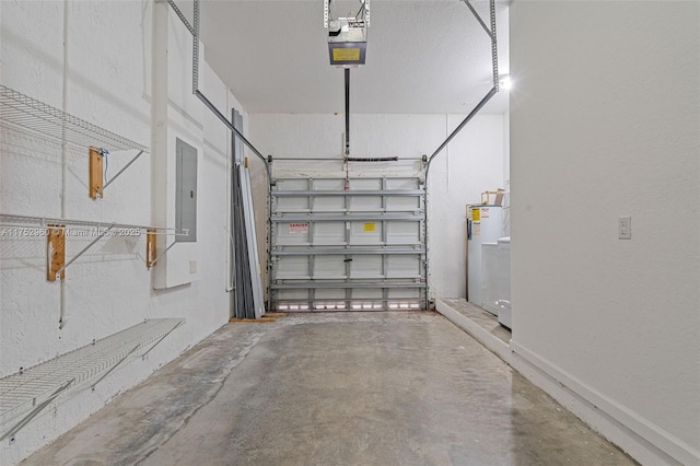 garage with a garage door opener, electric panel, electric water heater, and a textured wall