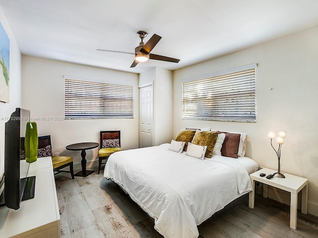 bedroom featuring ceiling fan and light wood finished floors