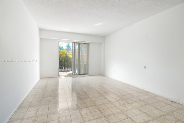 empty room with a textured ceiling