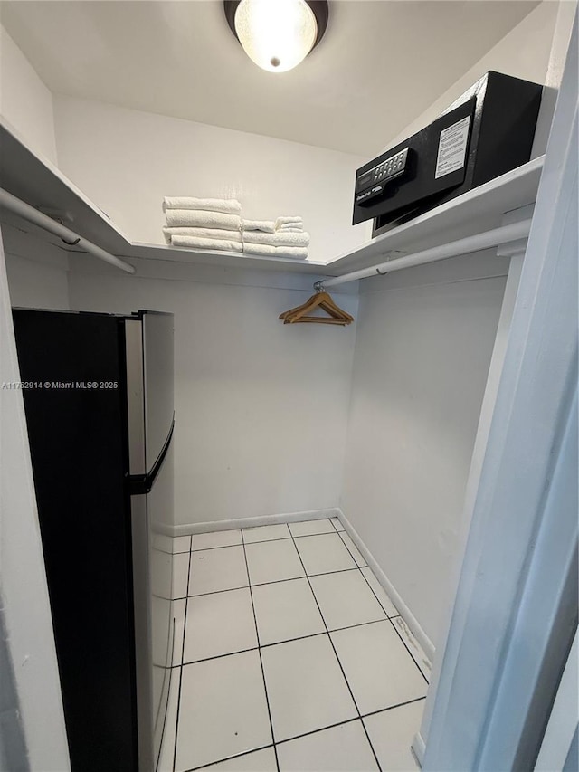 walk in closet featuring light tile patterned floors