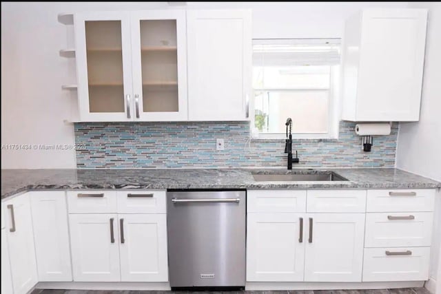 kitchen with white cabinets, glass insert cabinets, stainless steel dishwasher, open shelves, and a sink