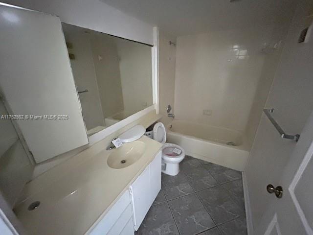 bathroom with toilet, tub / shower combination, and vanity