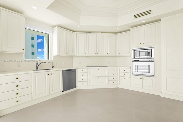 kitchen with white oven, visible vents, stainless steel microwave, a sink, and dishwasher