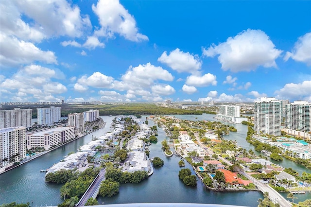 drone / aerial view featuring a water view and a view of city