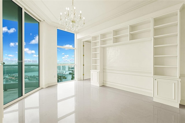 interior space featuring ornamental molding, expansive windows, and a notable chandelier