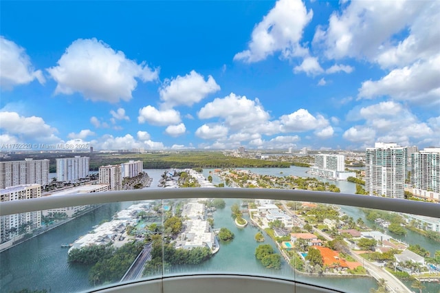 exterior space featuring a water view and a city view