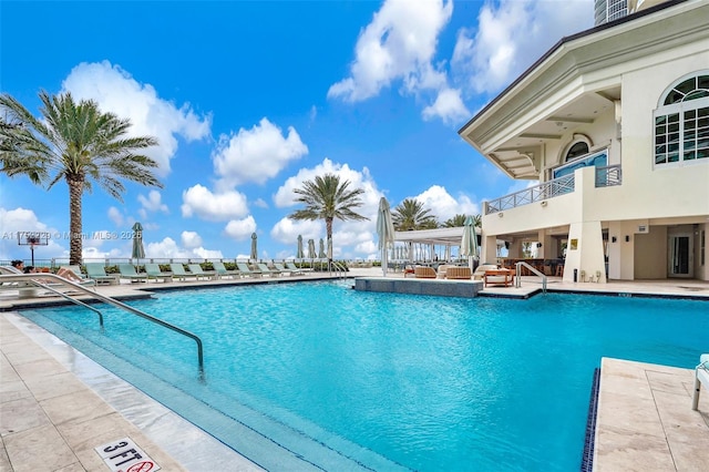 community pool featuring a patio area