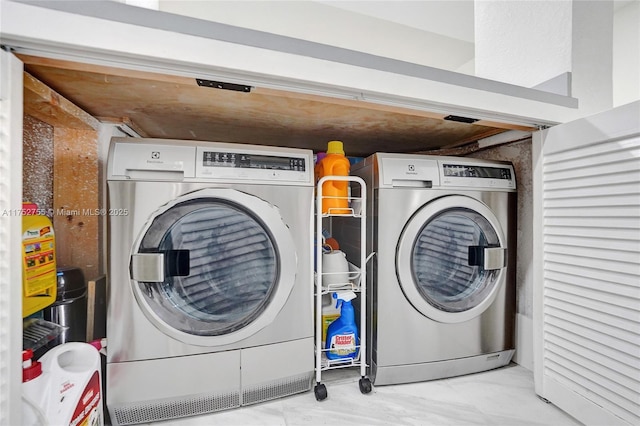 laundry area featuring laundry area and washer and clothes dryer