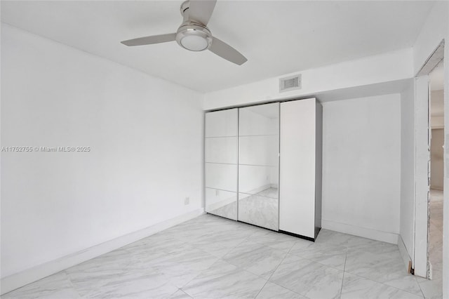 unfurnished bedroom featuring visible vents, ceiling fan, and baseboards