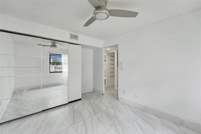 unfurnished bedroom featuring baseboards, a closet, visible vents, and a ceiling fan